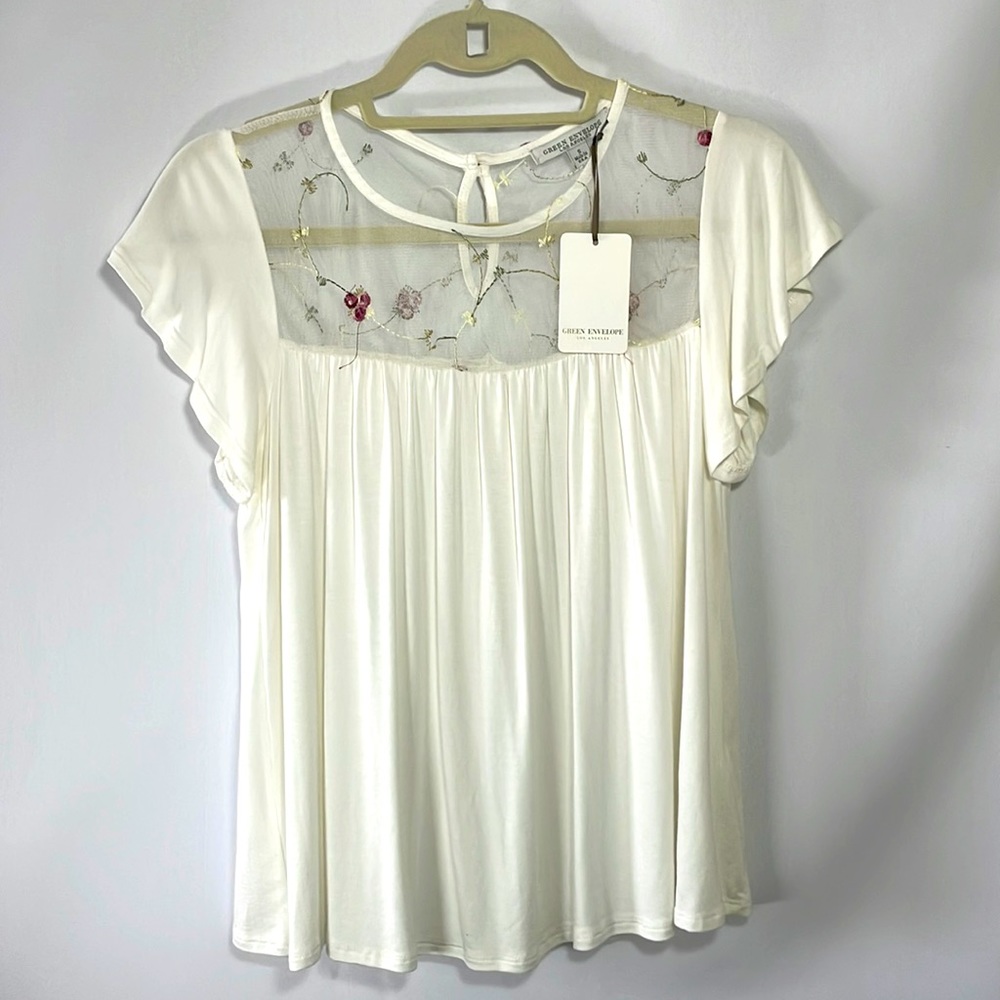 Green Envelope - White Blouse. Sheer upper with purple green floral detail.
